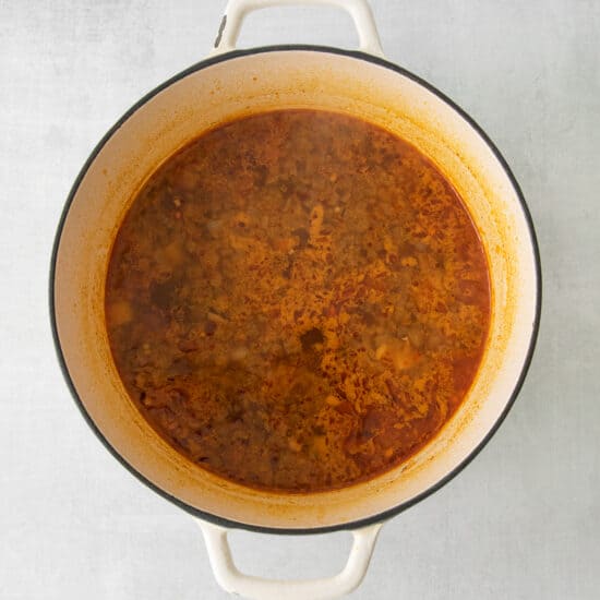 a pot of stew on a white background.