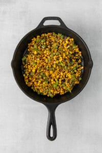 corn on the cob in a cast iron skillet.