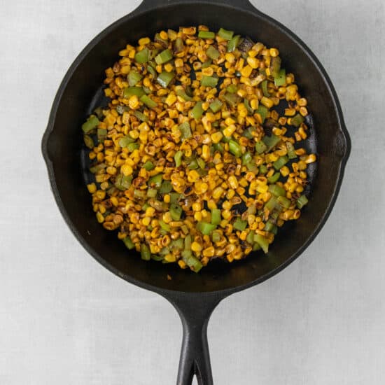 corn on the cob in a cast iron skillet.