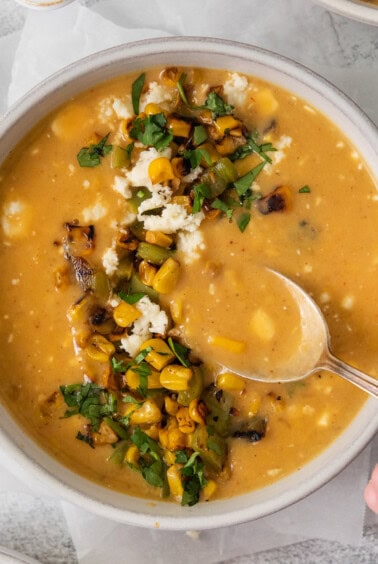 Mexican street corn soup in a bowl.