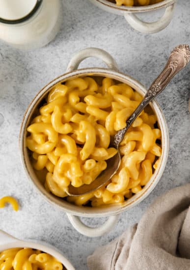 KFC mac and cheese in a bowl with a spoon.