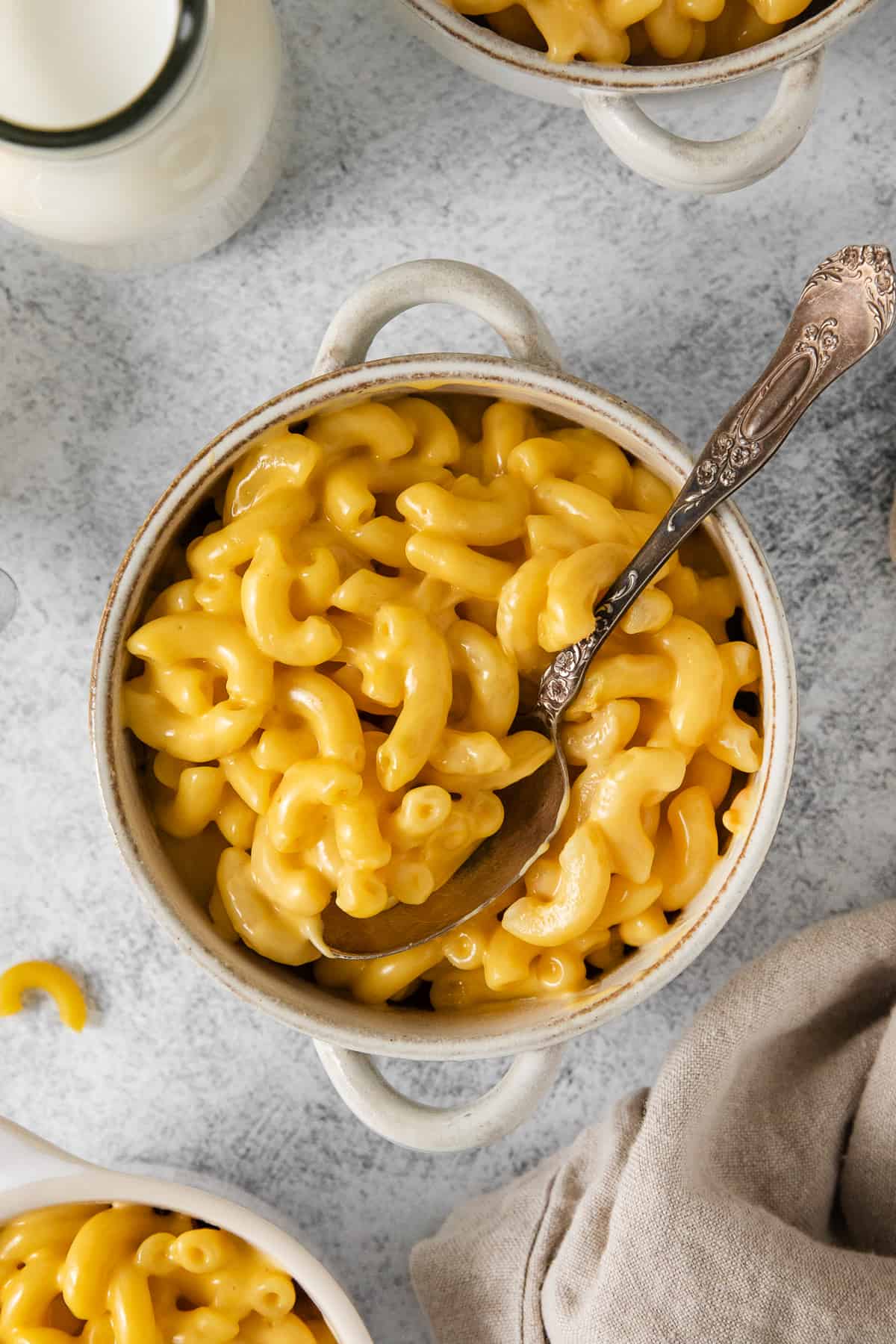 KFC mac and cheese in a bowl with a spoon.