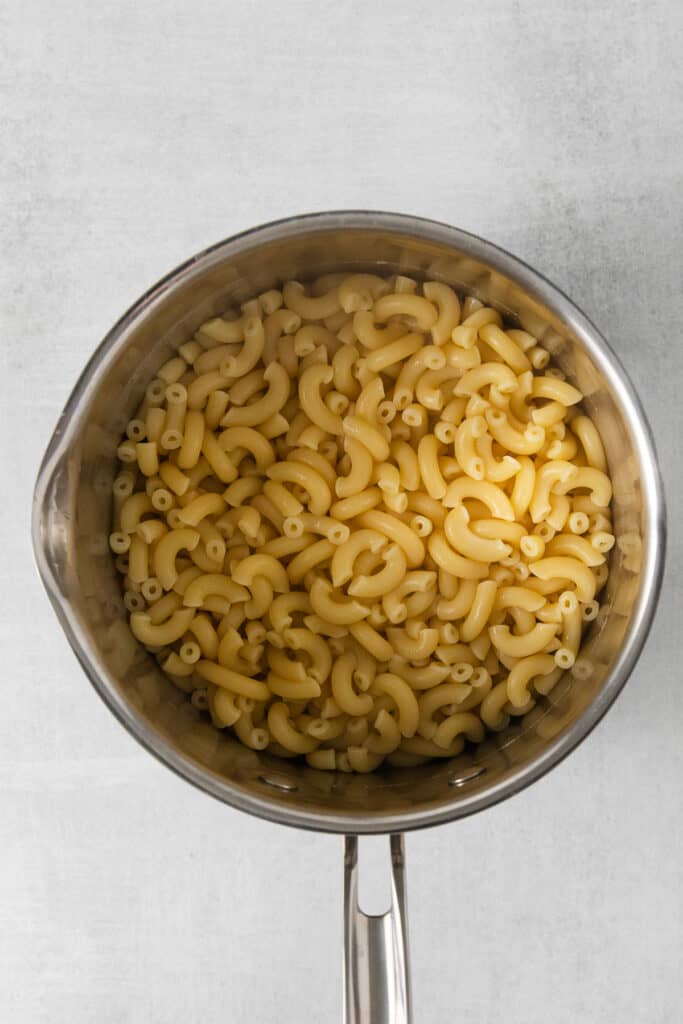 Macaroni noodles in a pot.