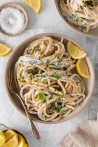 Lemon ricotta pasta served with fresh lemon slices.