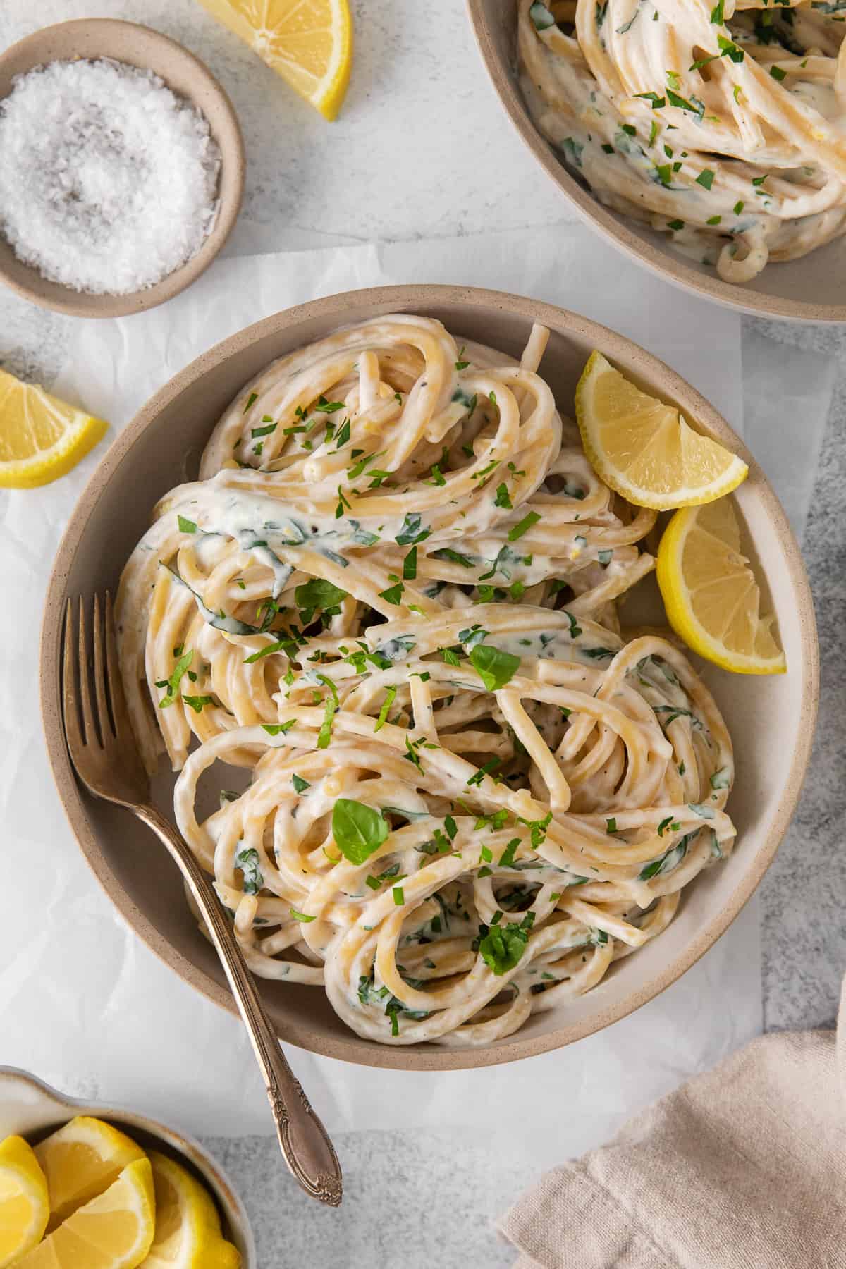 This zesty lemon ricotta pasta is cheesy, creamy, and full of bright lemon flavor! It makes for an easy and delicious weeknight dinner. Lemon ricotta pasta in a bowl.