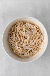 a bowl of noodles in a white bowl.