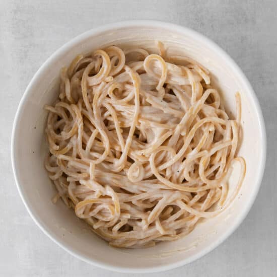 a bowl of noodles in a white bowl.