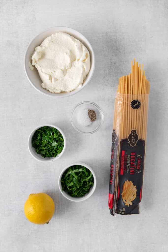 Ingredients for lemon ricotta pasta in bowls.