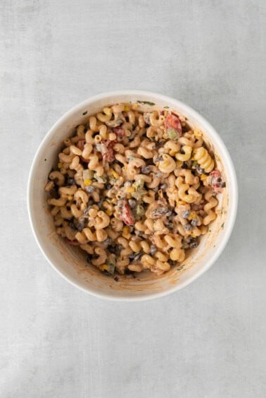 macaroni salad in a white bowl.