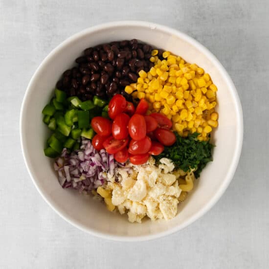 a bowl full of ingredients for a mexican salad.