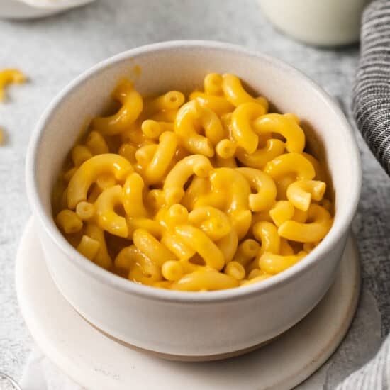 macaroni and cheese in a white bowl.