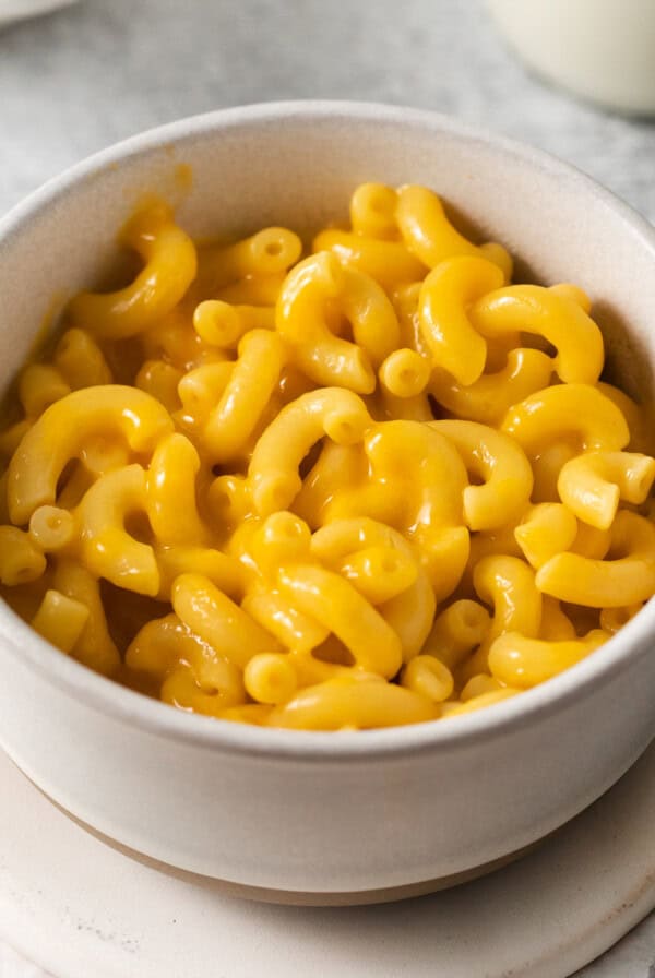 macaroni and cheese in a white bowl.