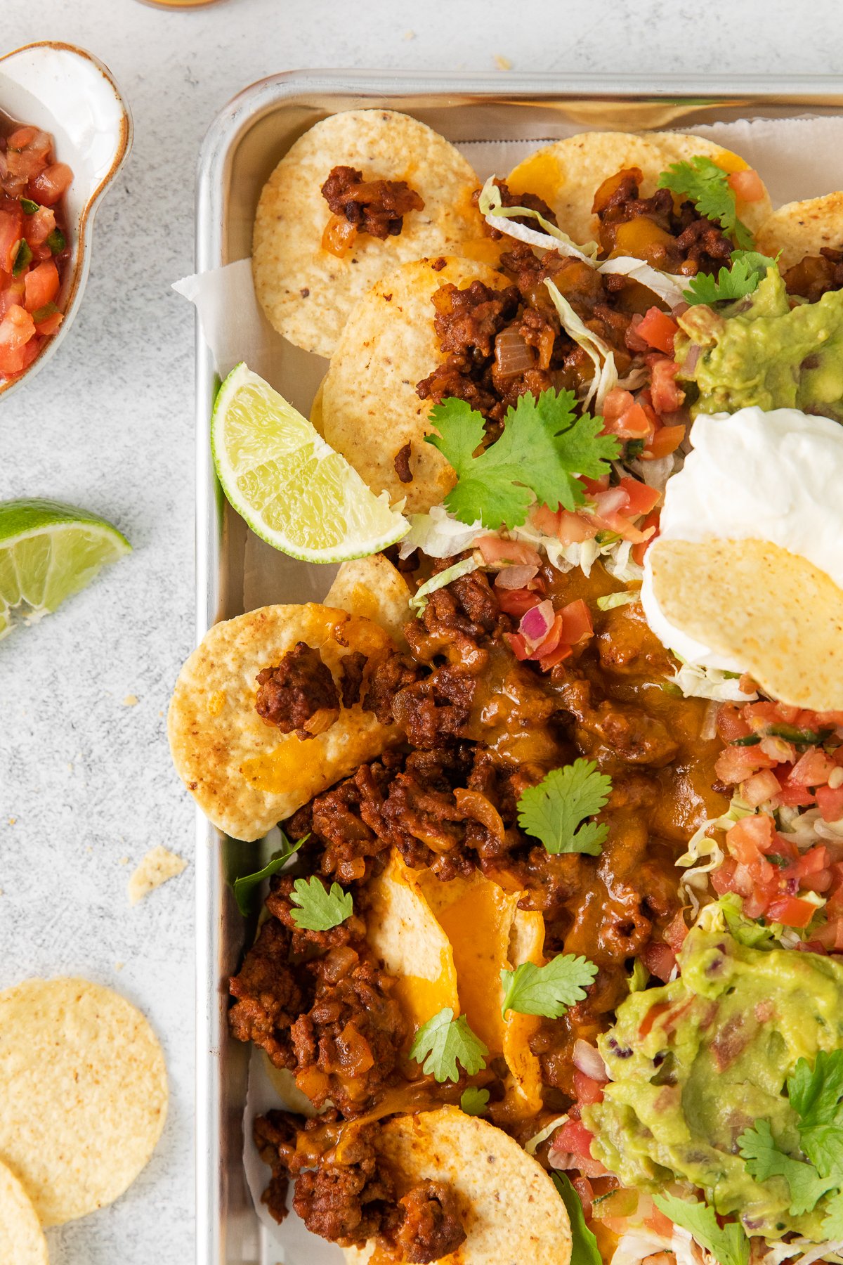 Beef nachos on a baking sheet.