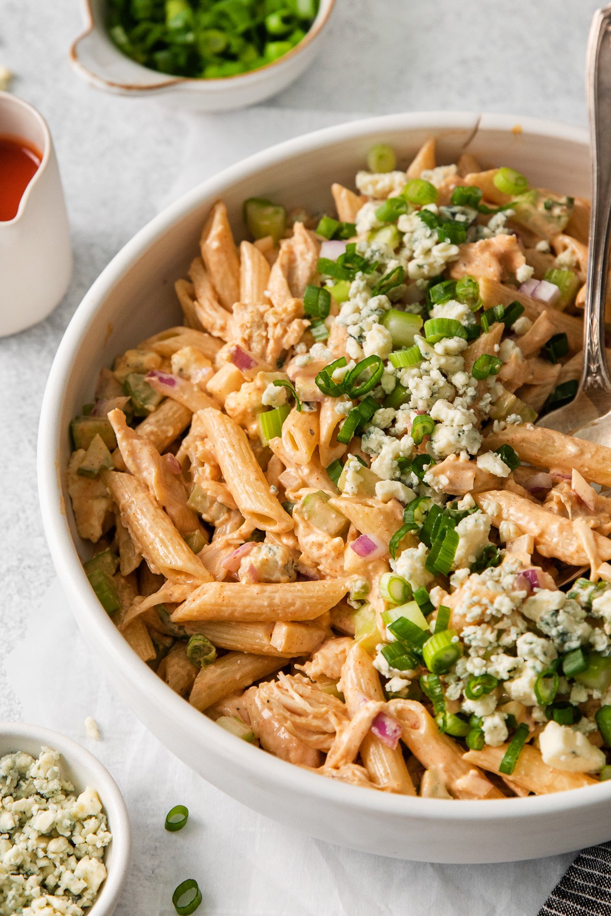 Buffalo chicken pasta salad in bowl.