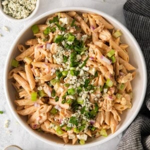 buffalo chicken pasta salad in a white bowl.