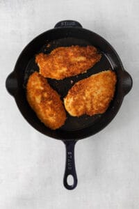 fried chicken in a cast iron skillet.