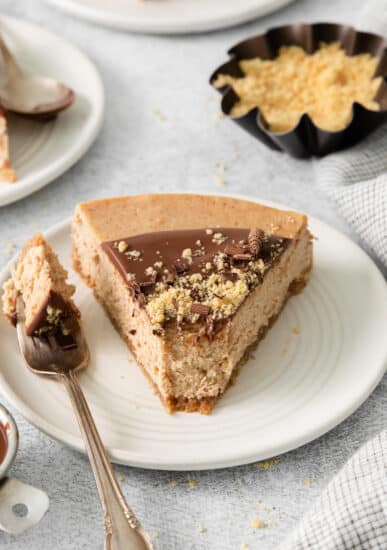 Slice of churro cheesecake on a plate.
