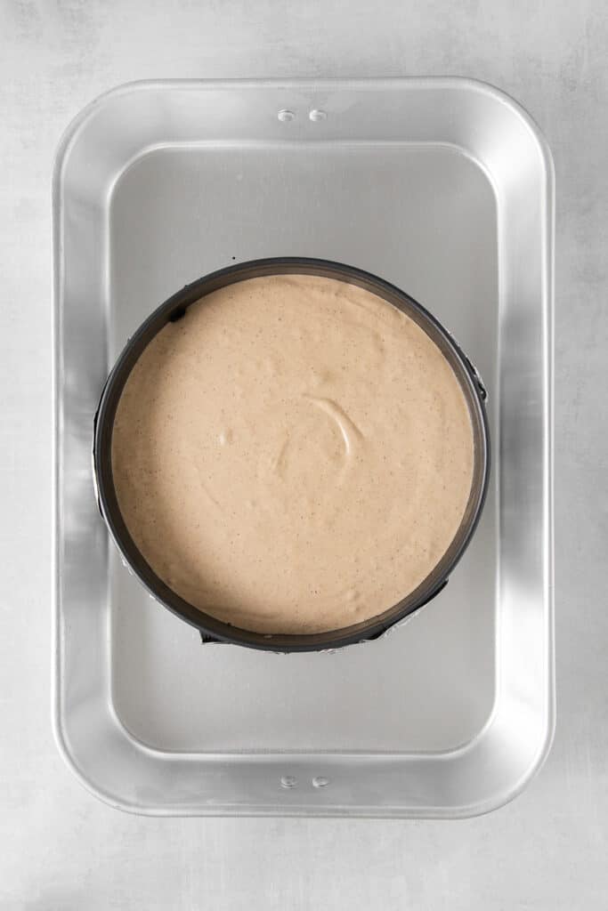 Churro cheesecake batter in a spring form pan.