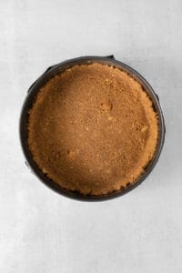 a pie in a pan on a white surface.