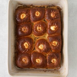 buns in a baking dish on a white background.