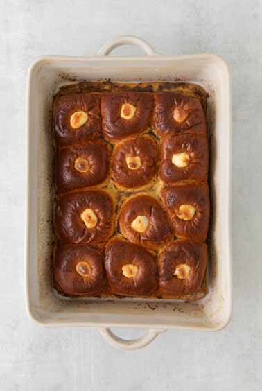 buns in a baking dish on a white background.