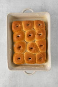 bagels in a baking dish on a white surface.