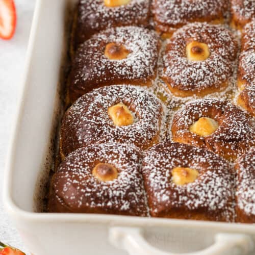 Hawaiian roll french toast in a casserole dish.