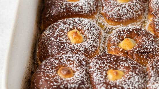 Hawaiian roll french toast in a casserole dish.