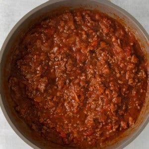 chili in a pan on a white surface.