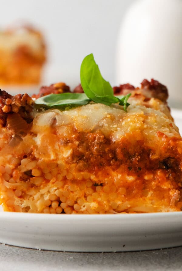 Slice of million dollar spaghetti on a plate.