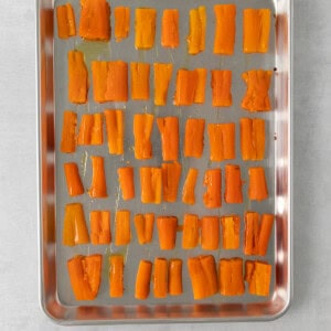 sliced carrots on a baking sheet.