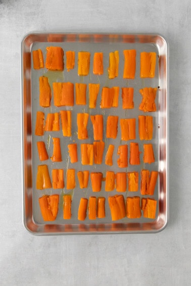 sliced carrots on a baking sheet.