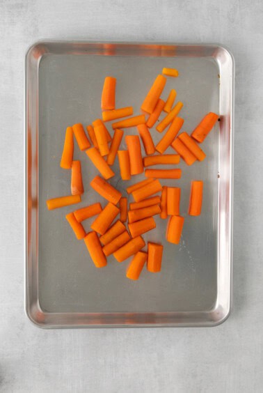 sliced carrots on a baking sheet.