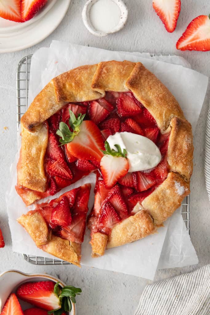 Strawberry cream cheese tart on a cooling rack.