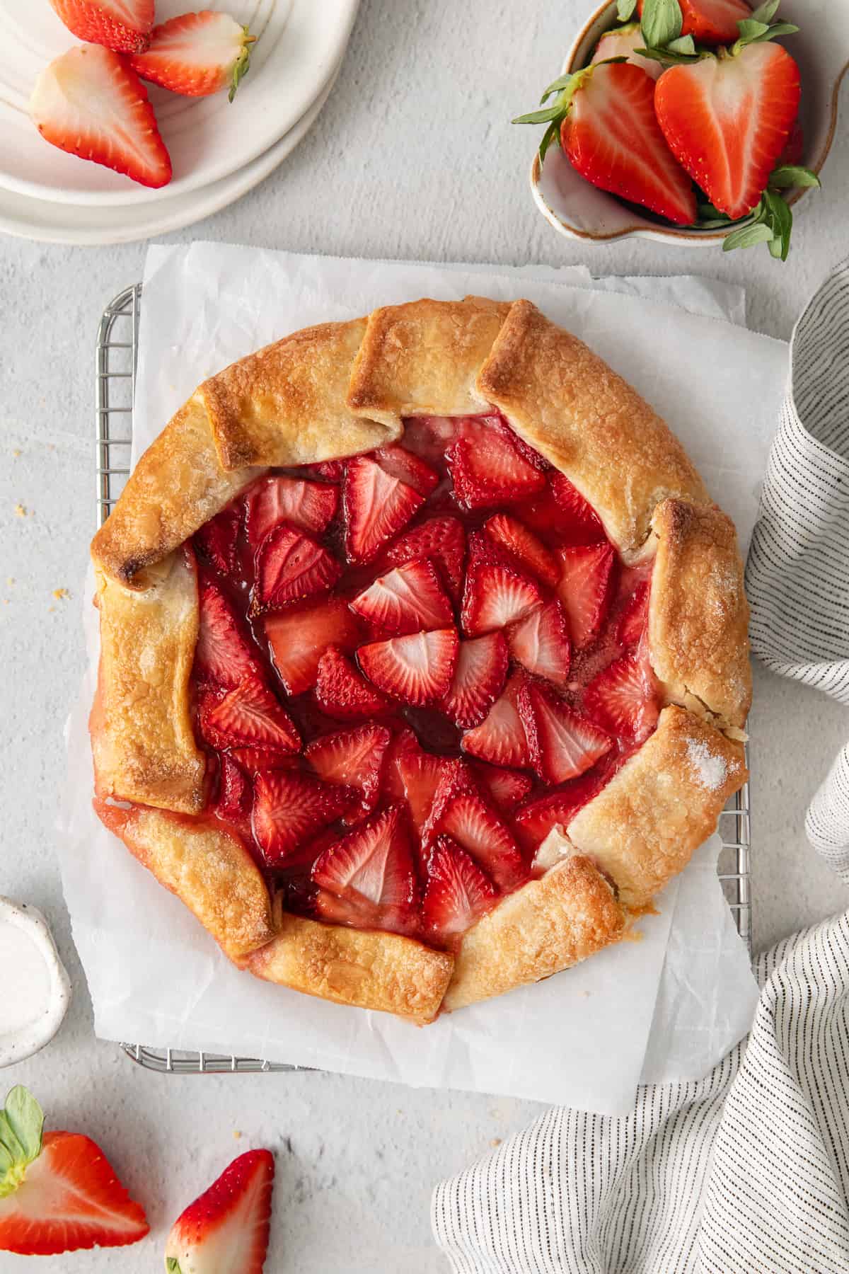 Strawberry cream cheese tart on a cooling rack.