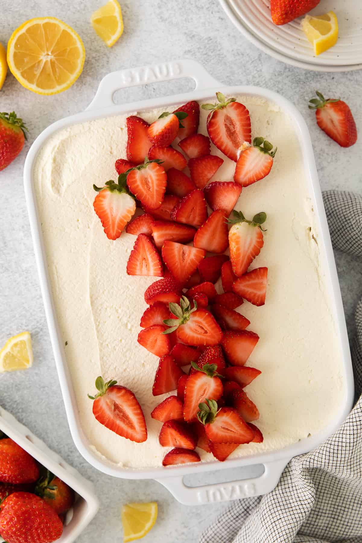 Strawberry tiramisu topped with sliced strawberries.