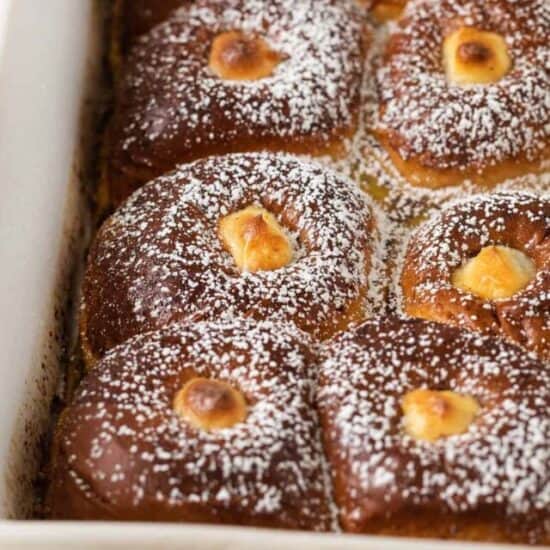 Hawaiian roll french toast in a casserole dish.