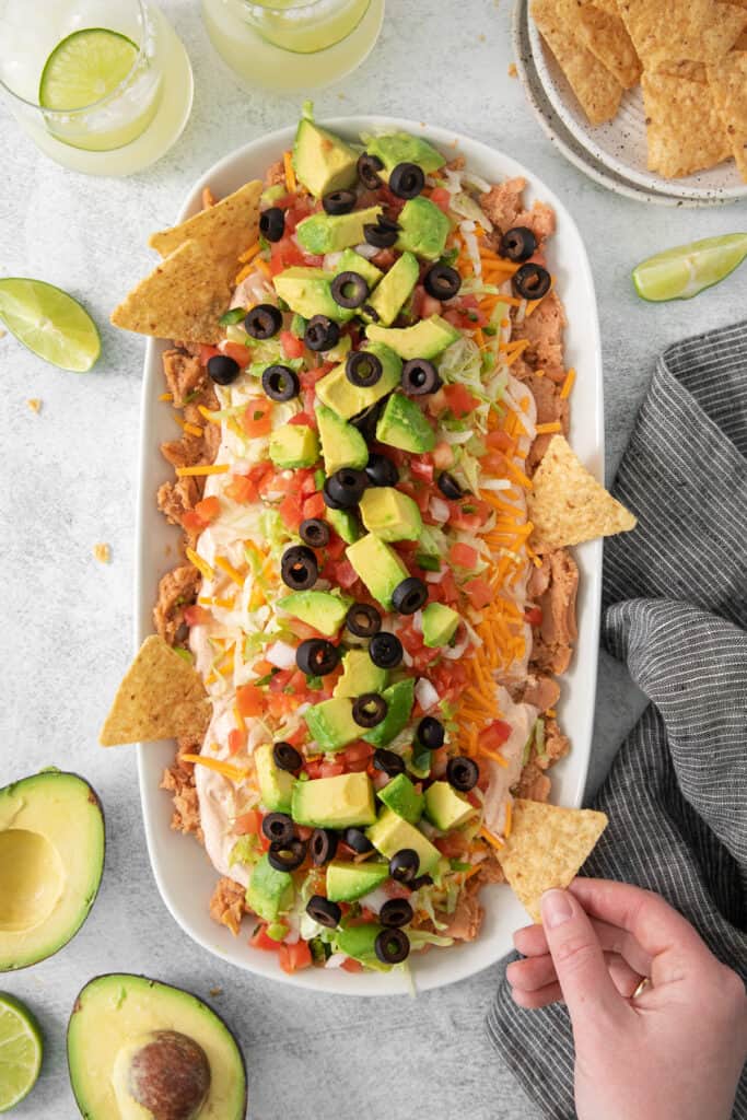 7 layer taco dip in a serving dish.