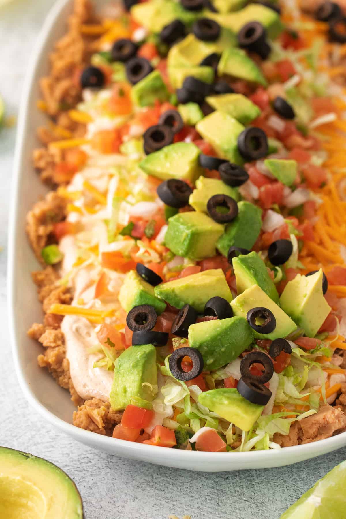 7 layer taco dip in a serving dish.