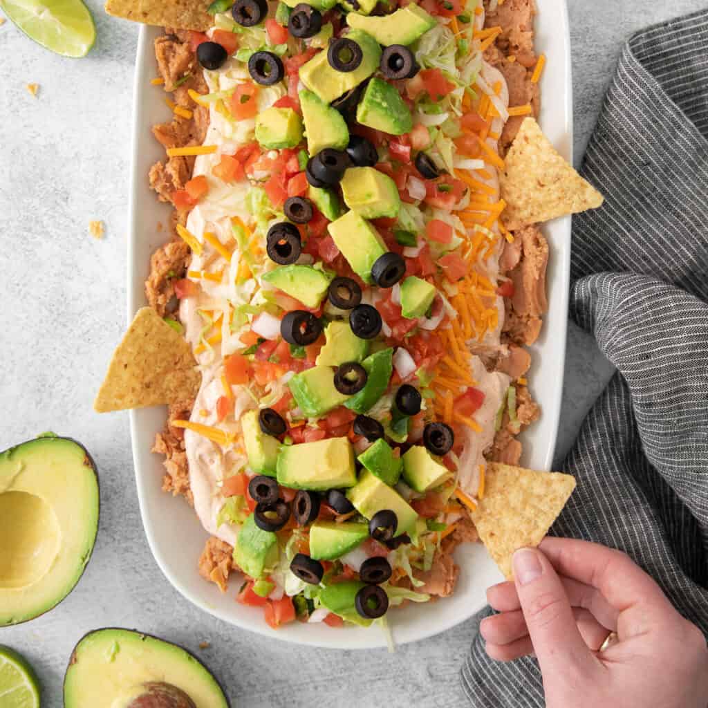 7 layer taco dip in a serving dish.