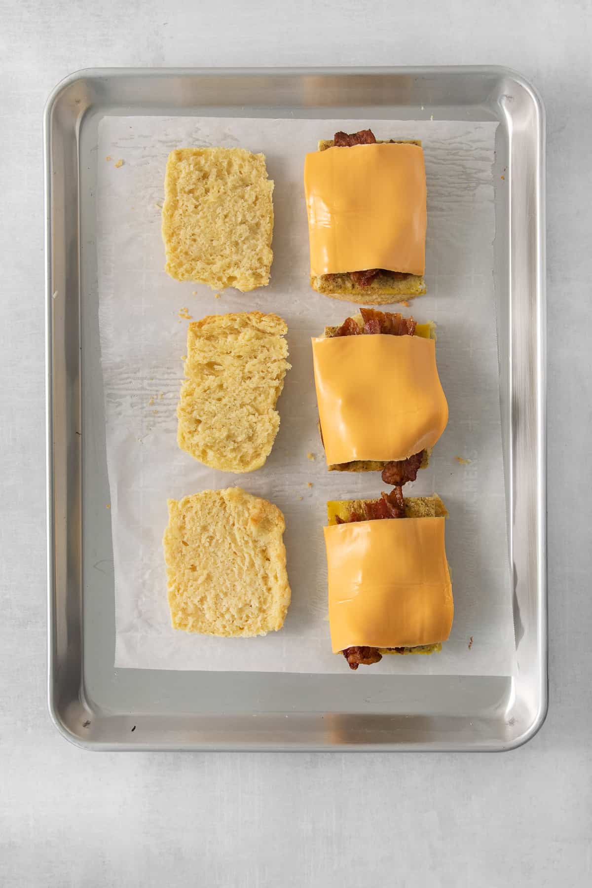 cheesy tater tots on a baking sheet.