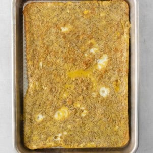 a square of omelette in a metal pan.