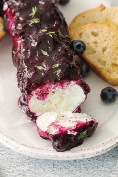 Blueberry goat cheese appetizer on a plate.
