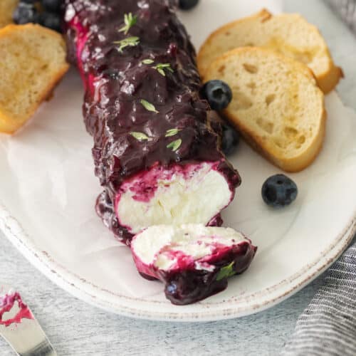 Blueberry goat cheese appetizer on a plate.