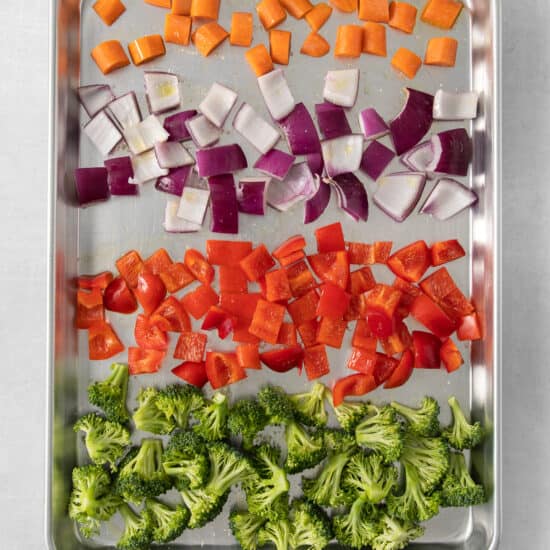 a tray of chopped vegetables including broccoli and carrots.