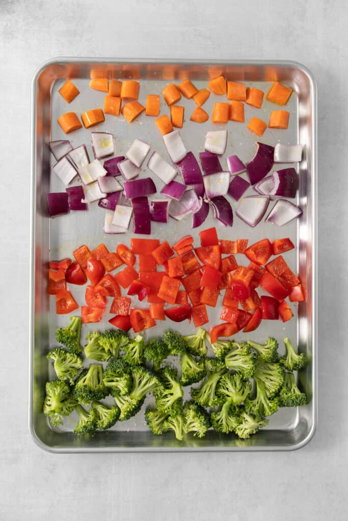 a tray of chopped vegetables including broccoli and carrots.