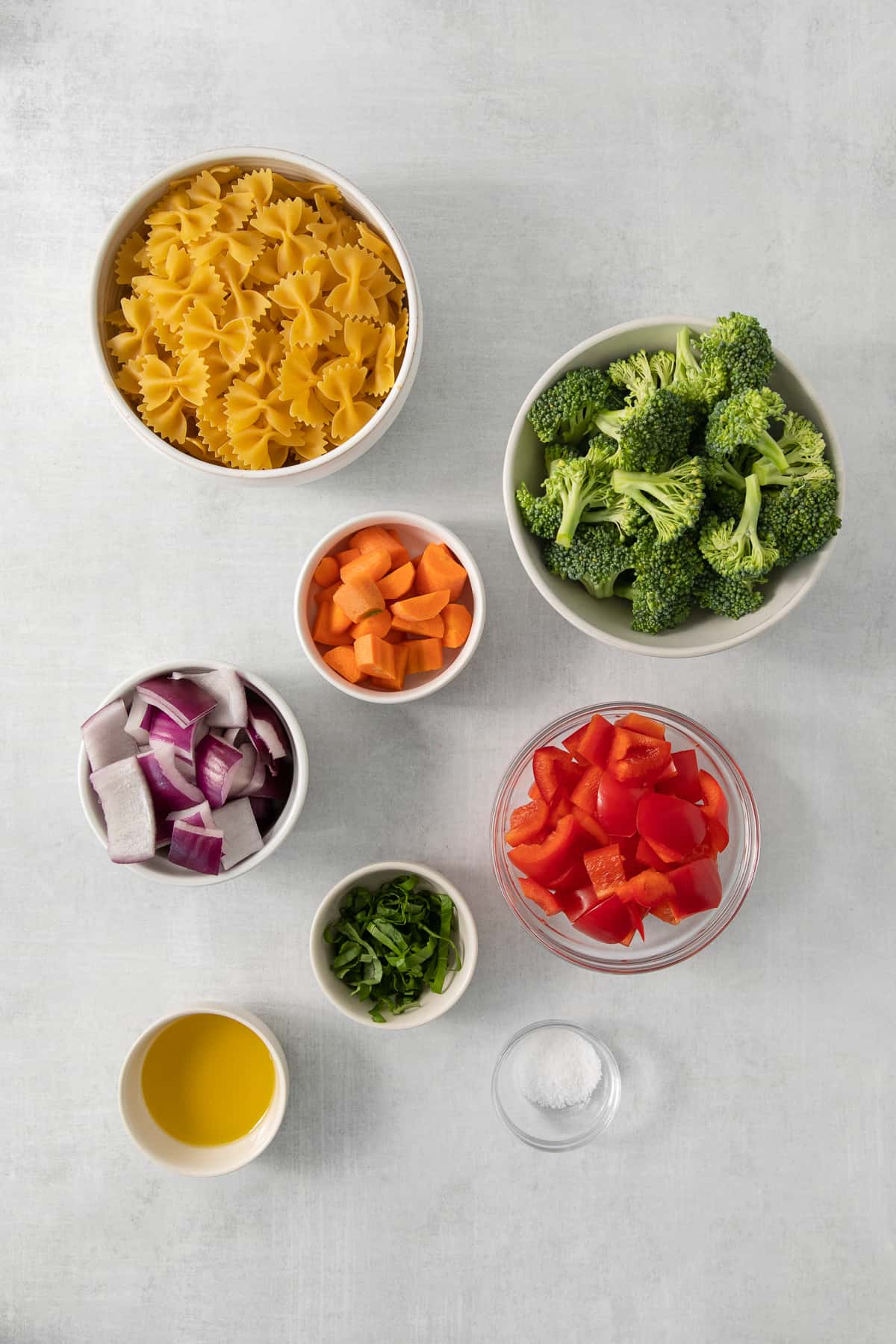 a table topped with bowls filled with different types of food.