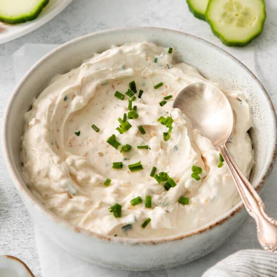 a bowl of cucumber dip with a spoon.