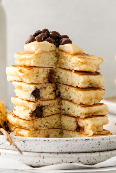 Cream cheese stuffed chocolate chip pancakes on a plate.