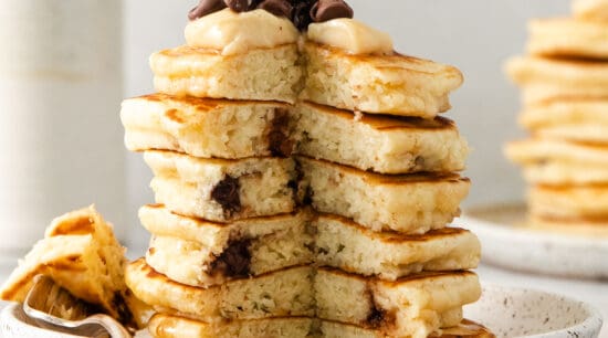 Cream cheese stuffed chocolate chip pancakes on a plate.